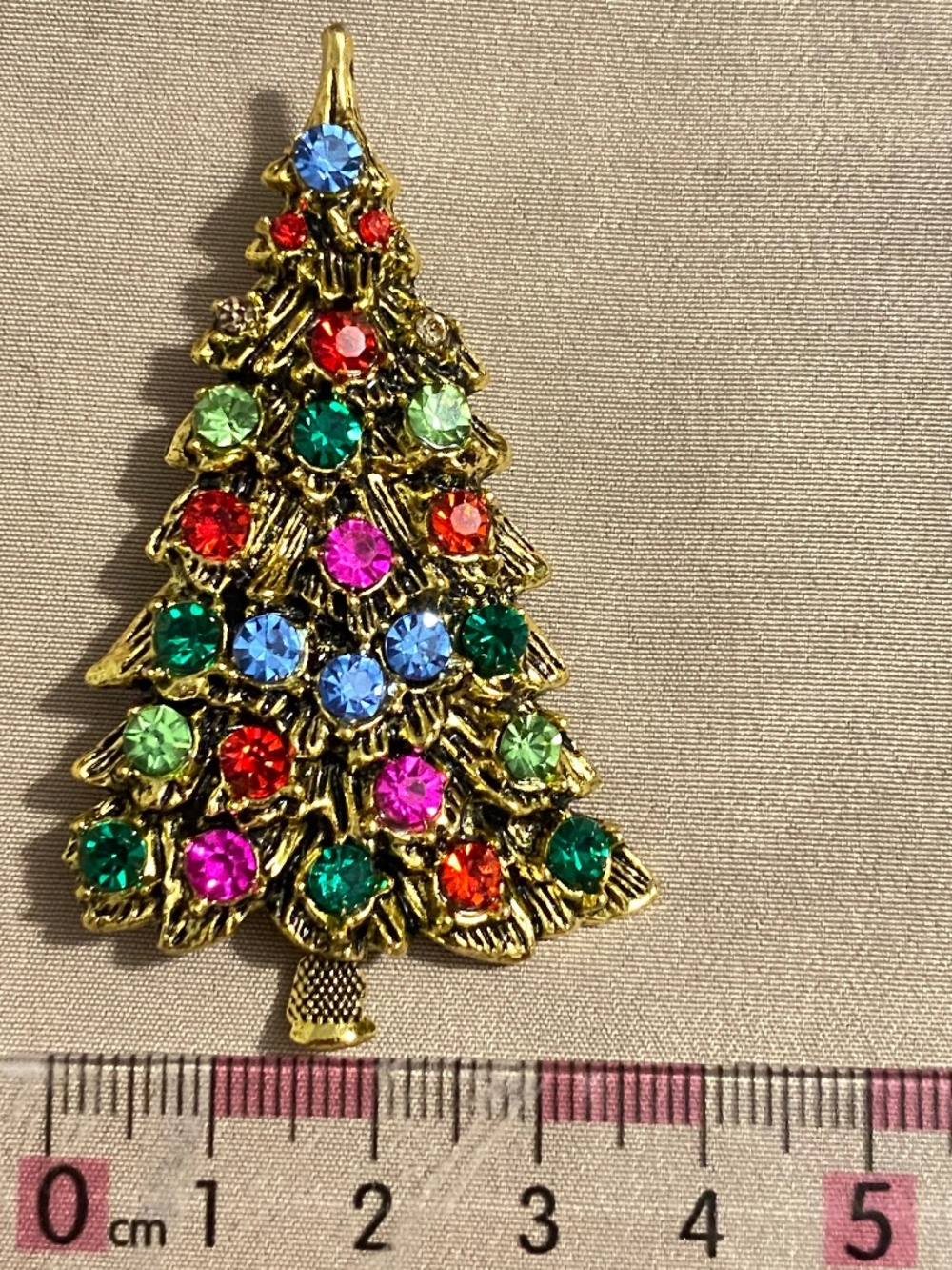 Three costume jewelry brooches